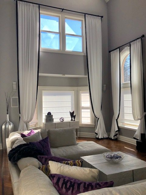 Pleated Draperies in High Windows in Living Room