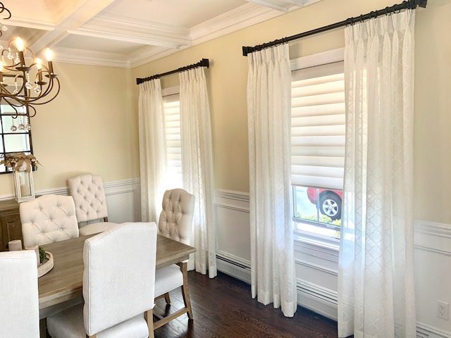 Sheer Pinch Pleat Stationary Drapery Side Panels Over Hunter Douglas Silhouette Shades in Dining Room