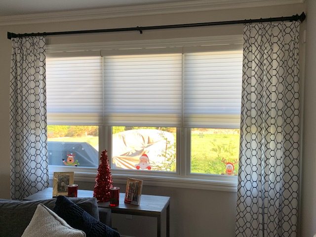 Pinch Pleat Drapery Panels on TRAX Rustic Bronze Hardware with Rings & Finials & Hunter Douglas Silhouette Shades in Family Room