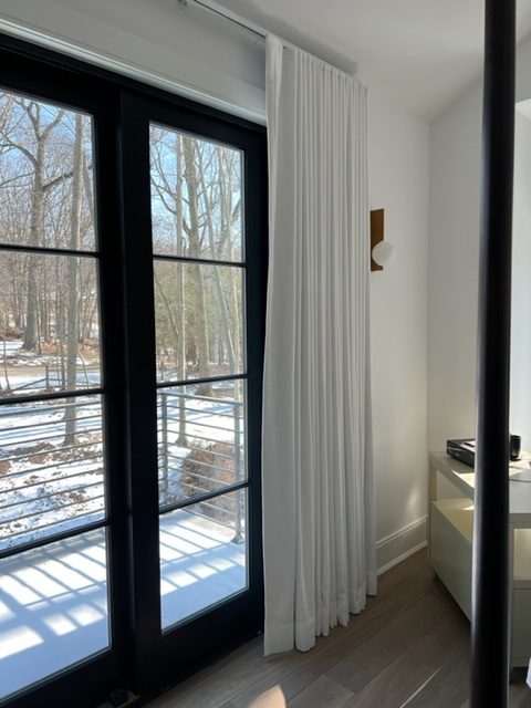 Ripple Fold White Linen Drapery Panels on Kirsch Architrac Hardware in Master Bedroom