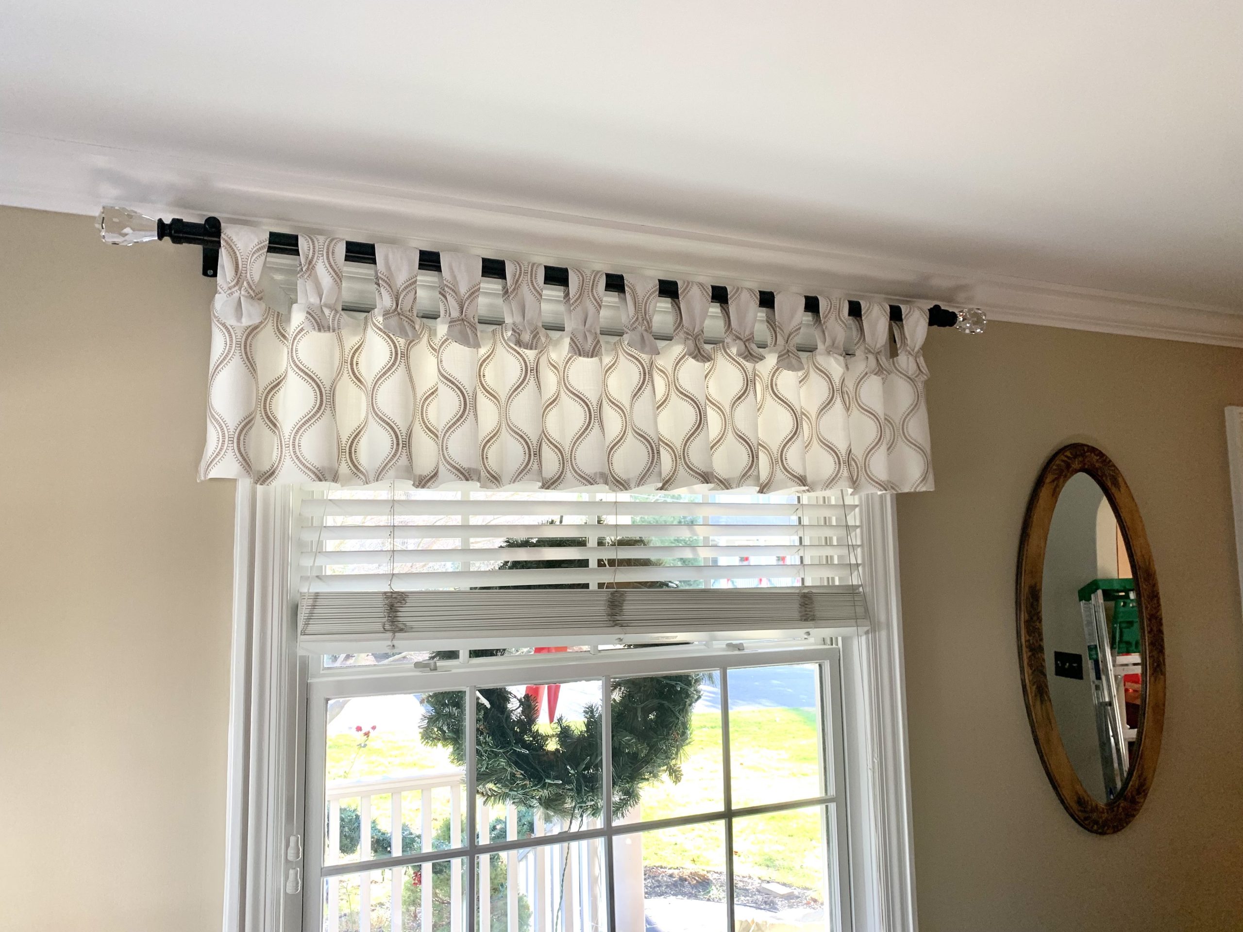 Tab Top Valance on a TRAX Black Metal Rod with Crystal Finials in Living Room