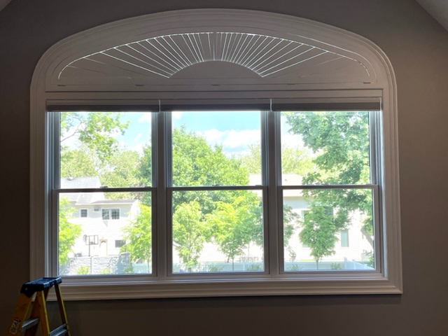 Custom Norman Window Treatments Composite Arched Shutter in Master Bedroom