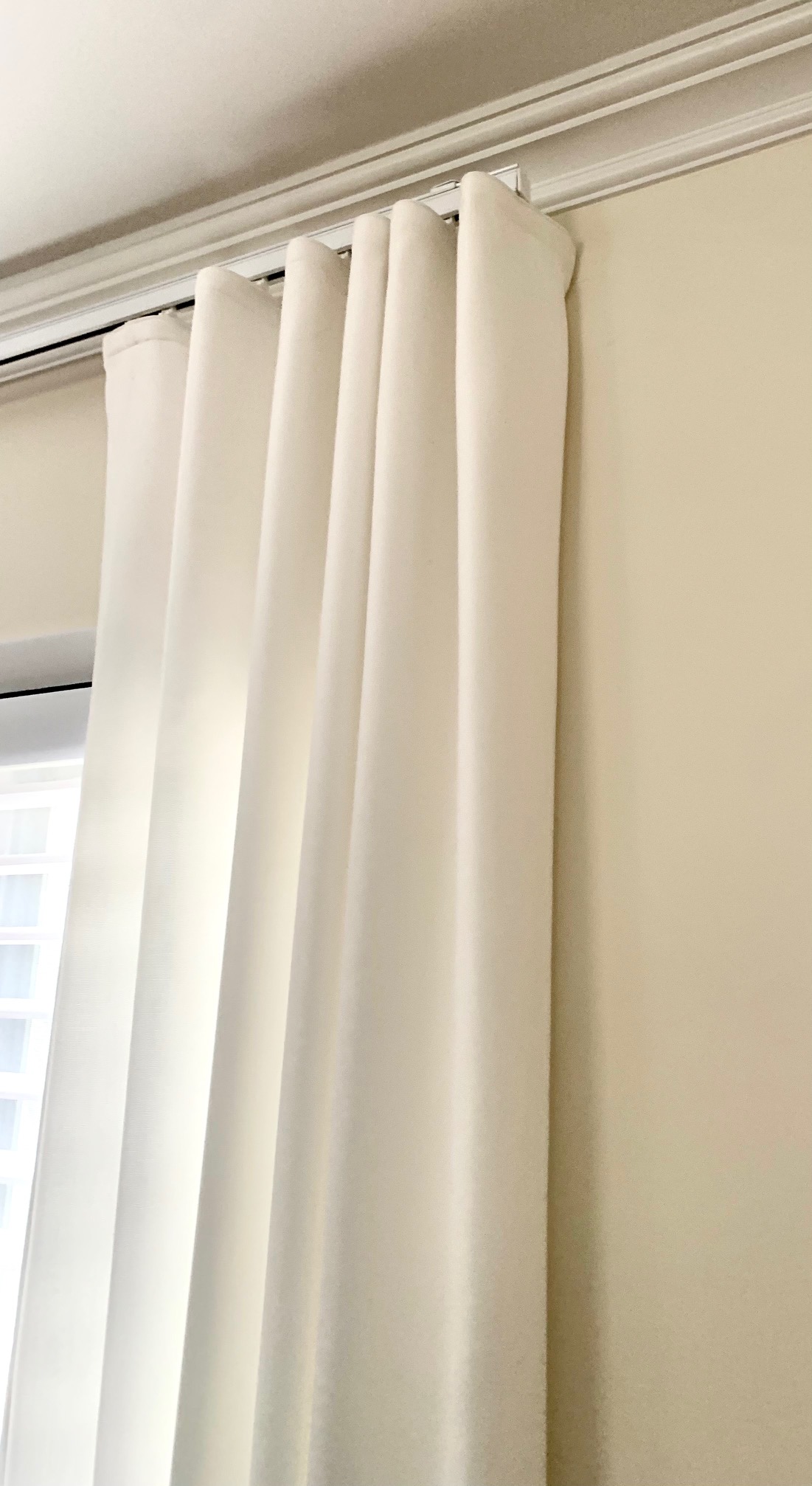 Ripple Fold White Linen Drapery Panels on Kirsch Architrac Hardware in Master Bedroom