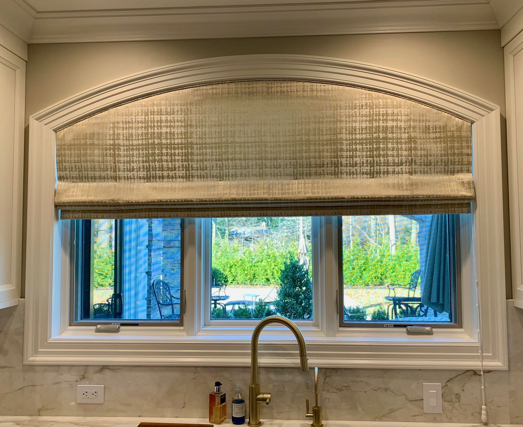Arched Roman Shade Using Norbar Fabric in Kitchen Window 