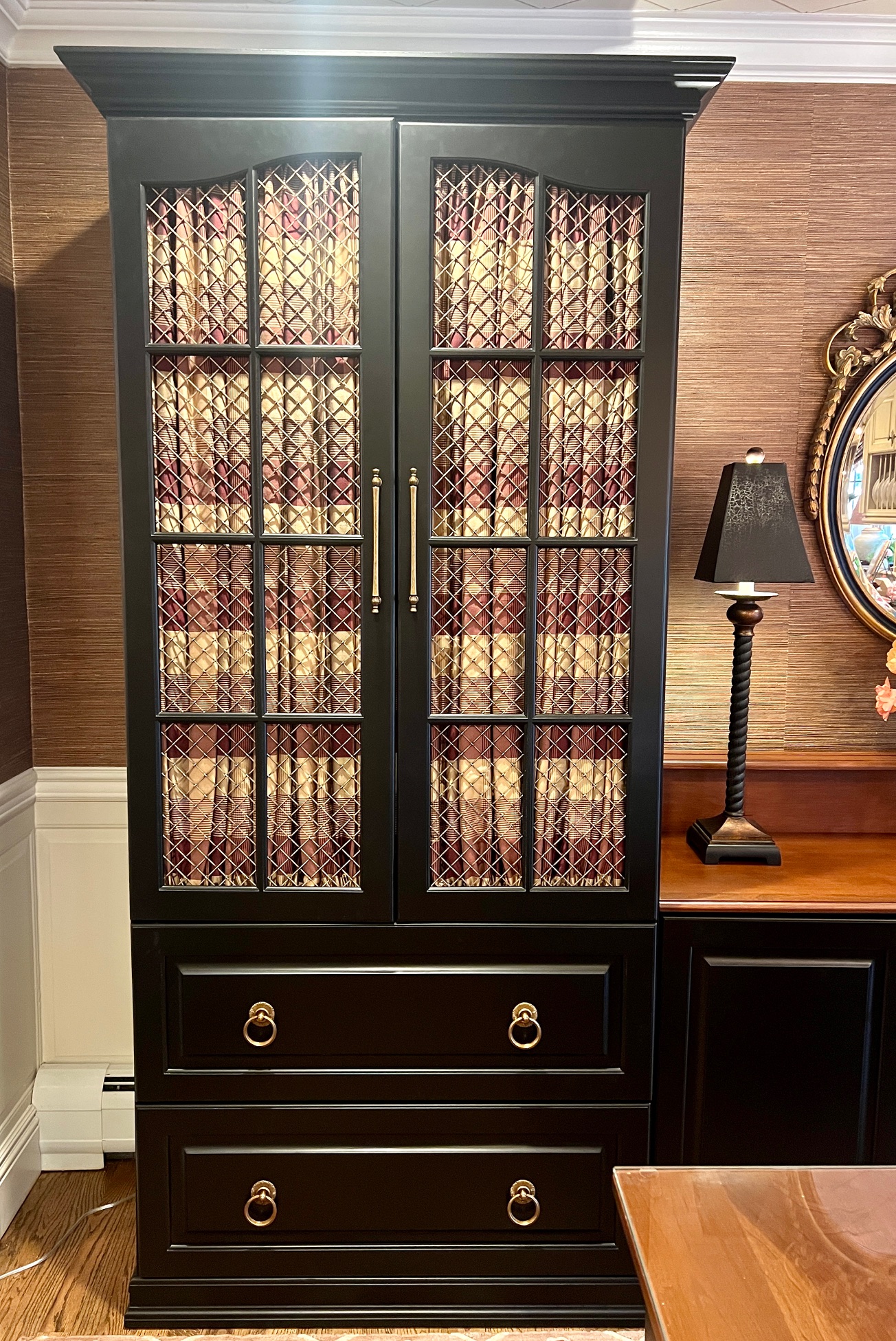 Shirred Stretch Drapery Panels Inside a Custom Dining Room Cabinet