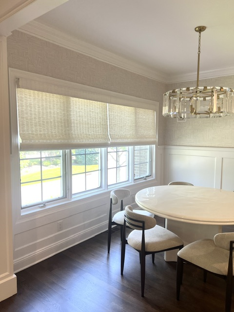 Alta Motorized Woven Wood Shade in Ivory Color with Light Filtering Lining in Breakfast Room